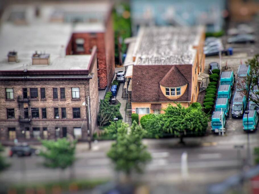 View of our building taken from the Space Needle. The bedroom window is in the front, the turret looking window