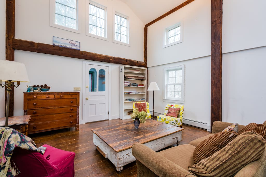 The 2-story living room. Breezes come through the top windows when they're open. The windows are tight, so not drafty in the wintertime.