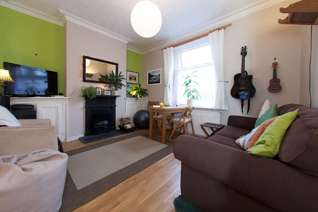 Cosy living room with dinning table, sofa and chairs