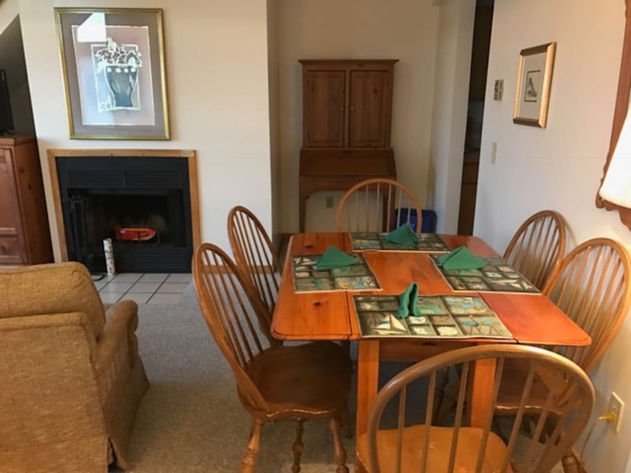 Open floor plan, dining area, fireplace.