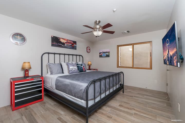 [Bedroom 7 / Lower Level] The Garage room with king bed