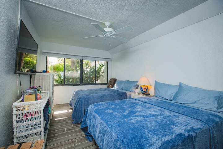 Second bedroom, overlooking a small court yard. Two full size beds. Large Smart TV with plenty of cable channels. High Speed internet for your entertainment!