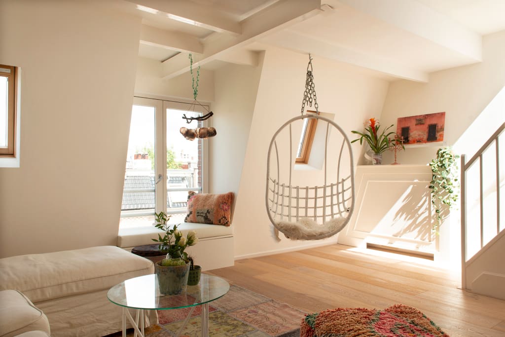 Make your relaxing afternoon even better by watching over the roofs in your swing chair
