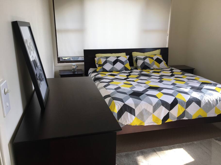 King bedroom mirrored wardrobe, ceiling fan, draws and windows with block out blinds