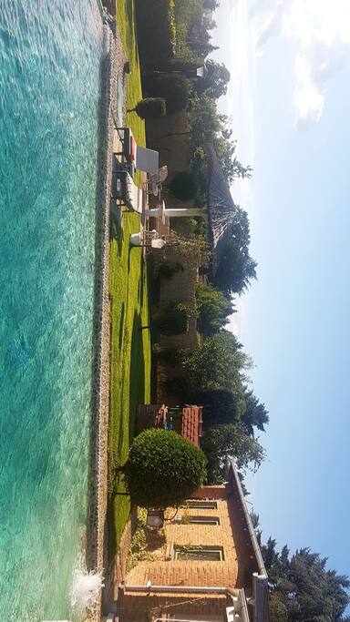 outside pool with 3 different hang out spots