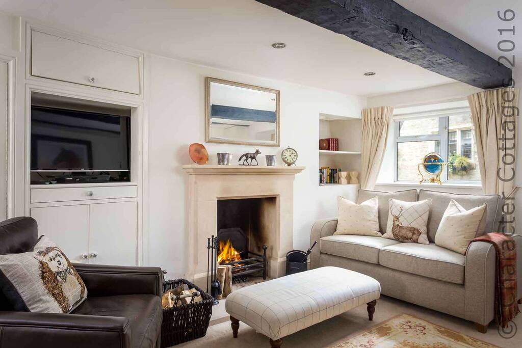 Enter into the living room and relax in front of the roaring fire