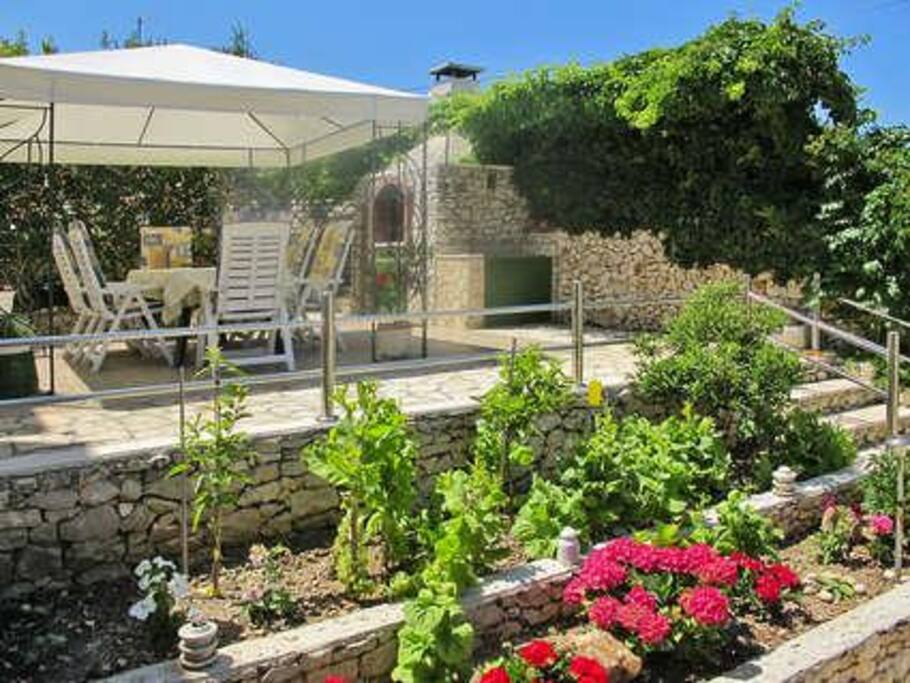 barbecue and dining furniture in our garden for your use