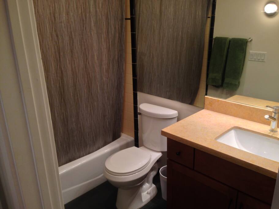 Private bathroom with bathtub & shower.