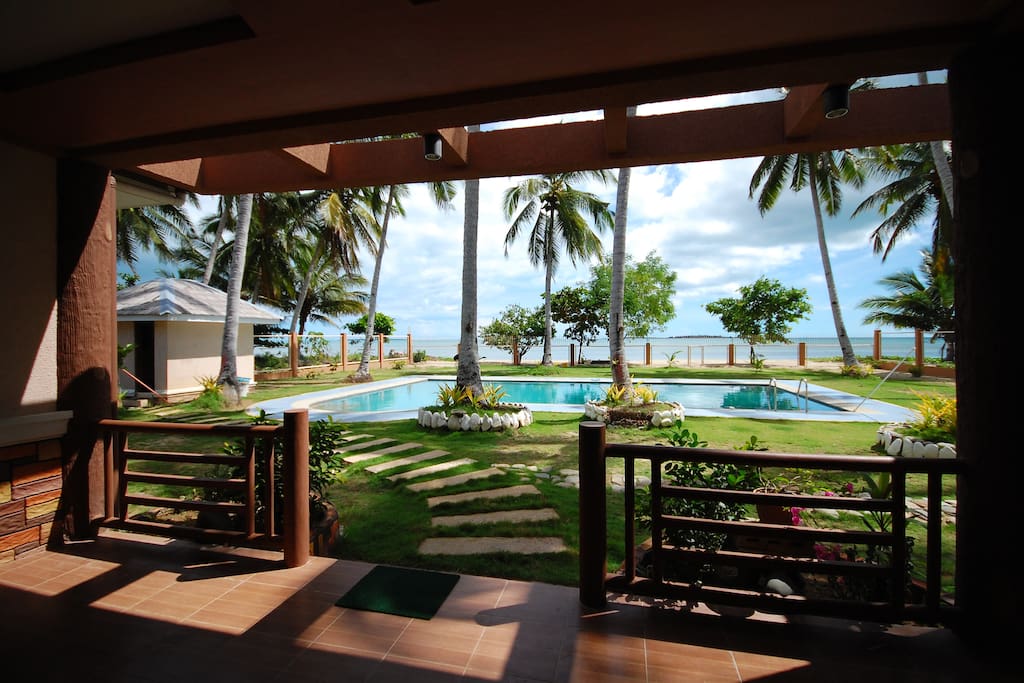 Patio looking at the pool and beach