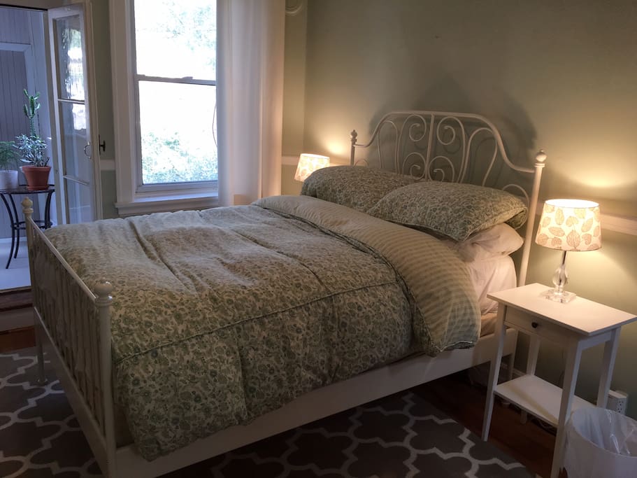 Bedroom with a double bed and sunroom