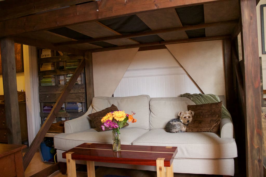 Couch and seating area underneath the loft. (Adorable puppy, not included)