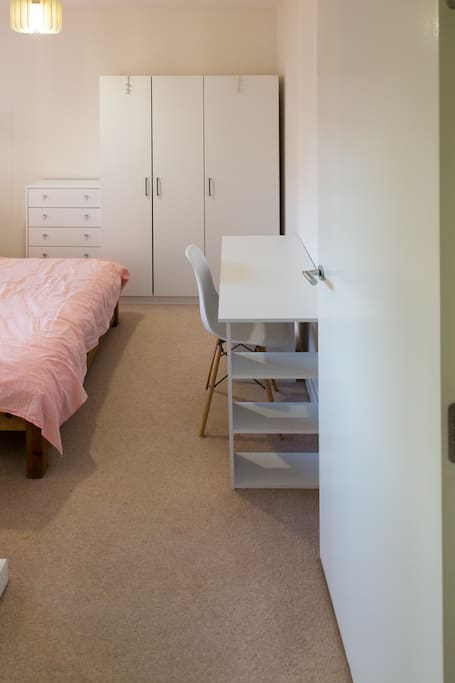 the room with double bed & desk