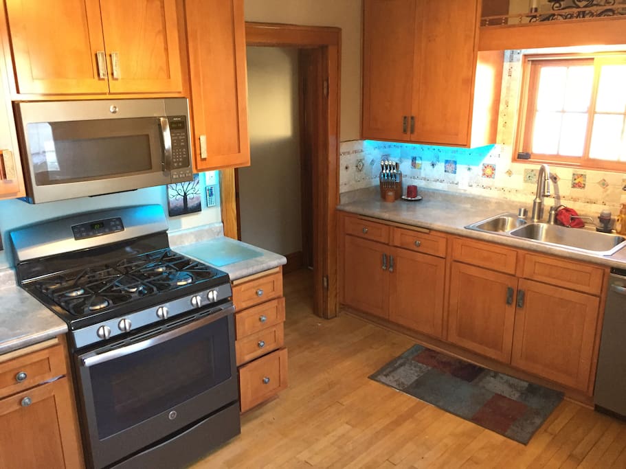 Fully stocked kitchen with new appliances.