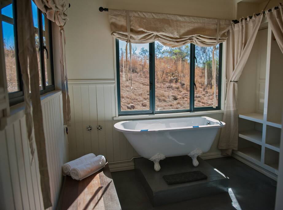 Bathroom with bath, shower and dressing area