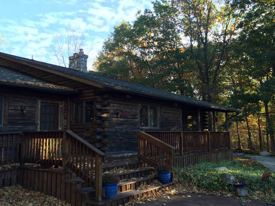 Porches surround the front, back, and side of the house to provide views of the river, the stream and the woods.
