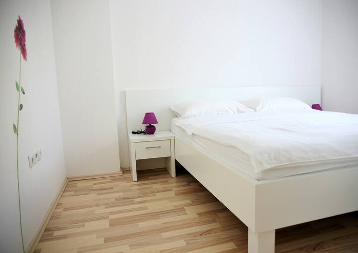 Bedroom with double bed and AC