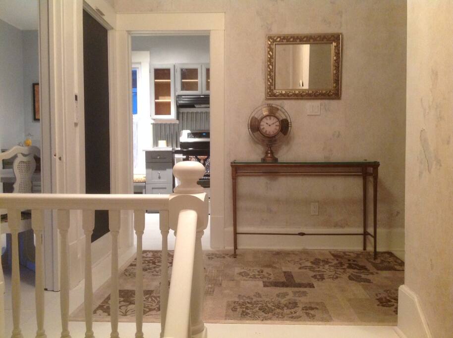 A lovely centre hall plan at the top of the stairs allows easy flow throughout this newly renovated apartment.