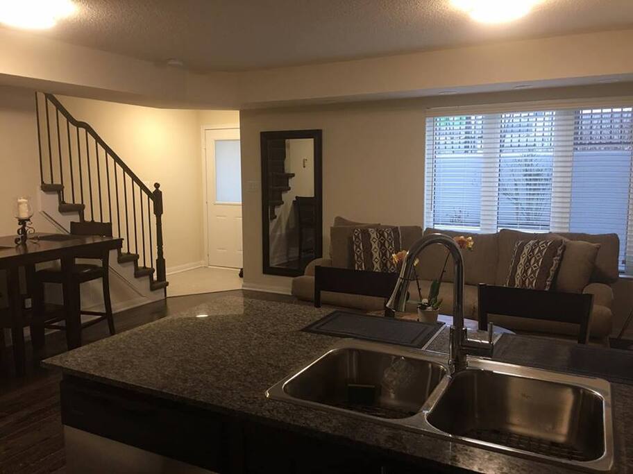 Front door opens up to living room/kitchen area and stairs on the left of screen to take you to upstairs bedrooms and bath. 1 double, 1 single, full washroom + a den