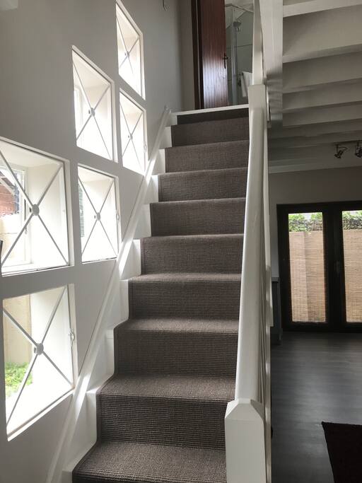 Easy, secure stairway to main bedroom area with full en suite bathroom