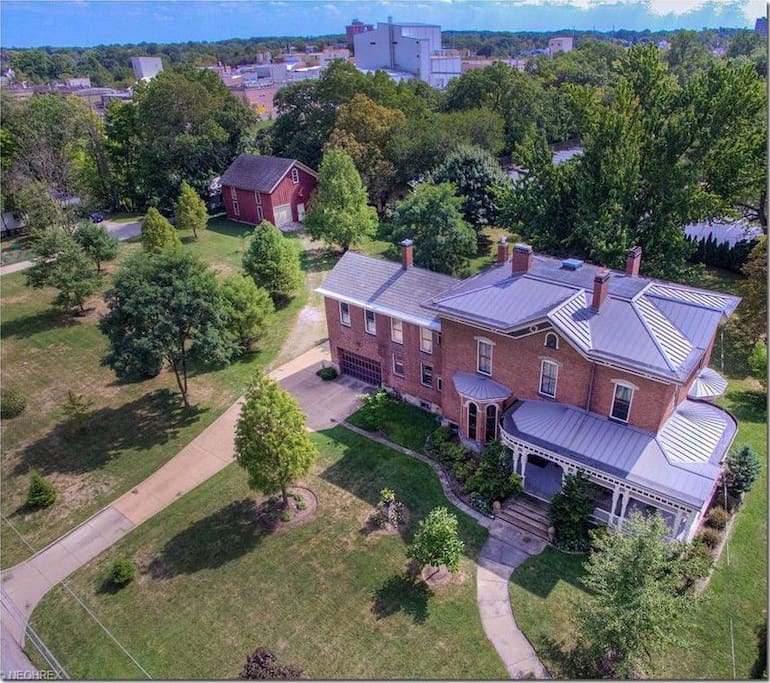 This picturesque landmark historic home, located in the heart of Elyria's historic district, is a 5 minute walk to the Downtown Elyria's Commons, featuring restaurants, shops, Elyria Public Library, Elywood Park, Historical Society, the East and West Black River Waterfalls, Cascade Park, and many other quaint attractions.