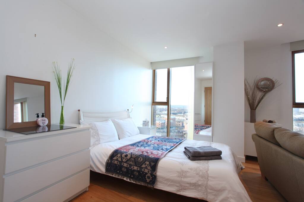 Studio room, the bed with lovely white bed linen and a fabulous view out of the window