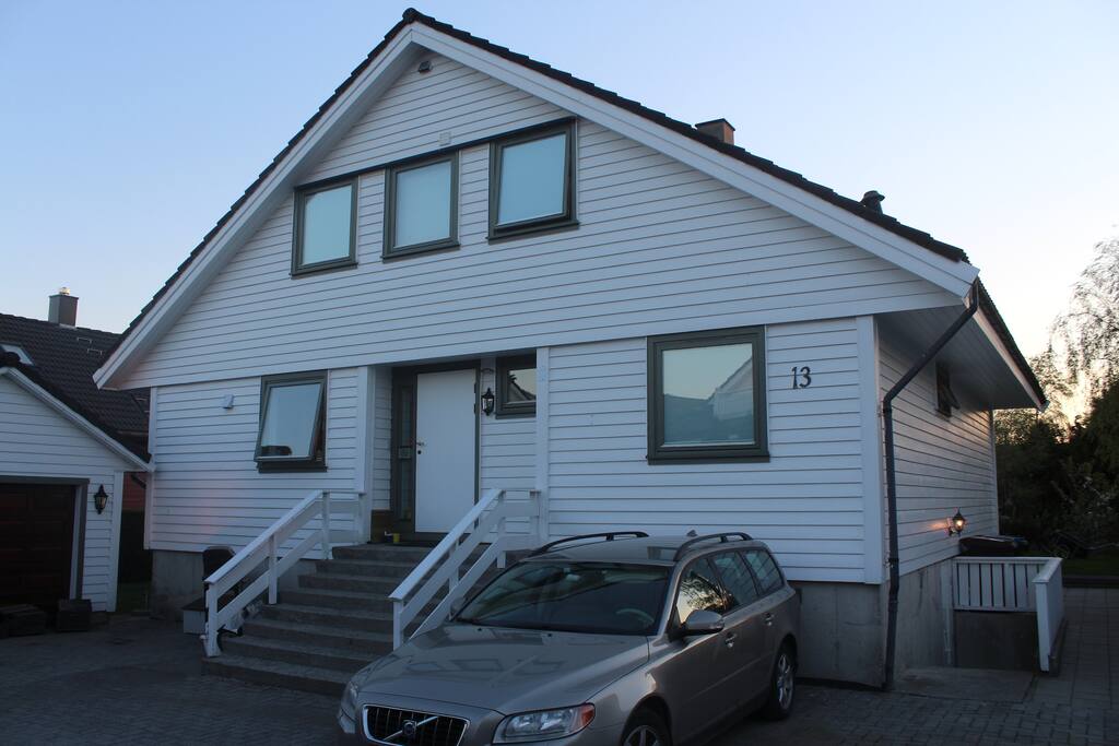 The entrance door is the one on the right side of the house.