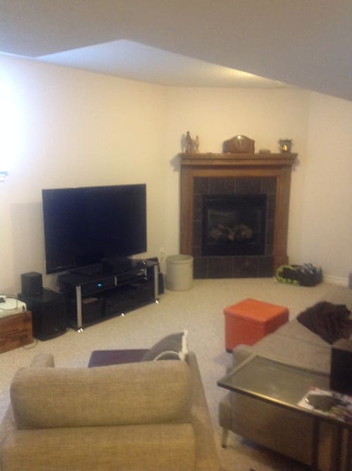 Bright, spacious sitting room with big screen TV with sound surround