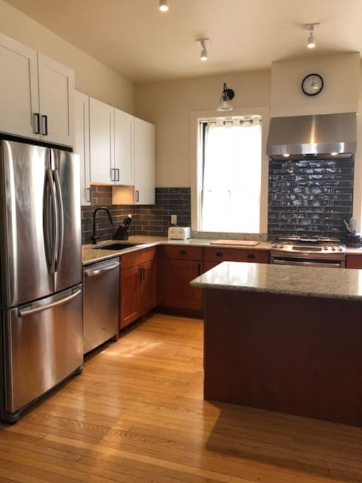 Large sink, stove, and exhaust hood