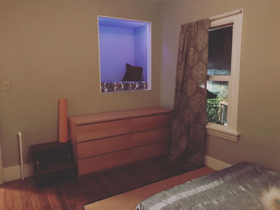 Reading nook and dresser in bedroom