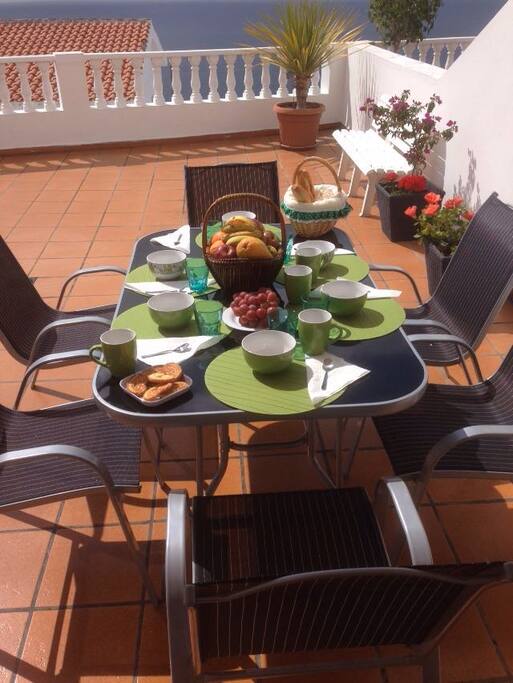 You can eat anytime you want at the table in the terrace looking at the sky and sea.