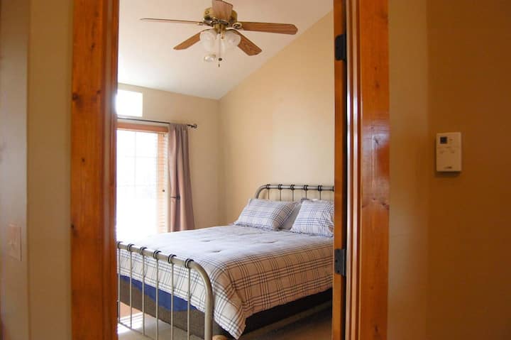 Master bedroom with ceiling fan. Large master closet with plenty of storage. 