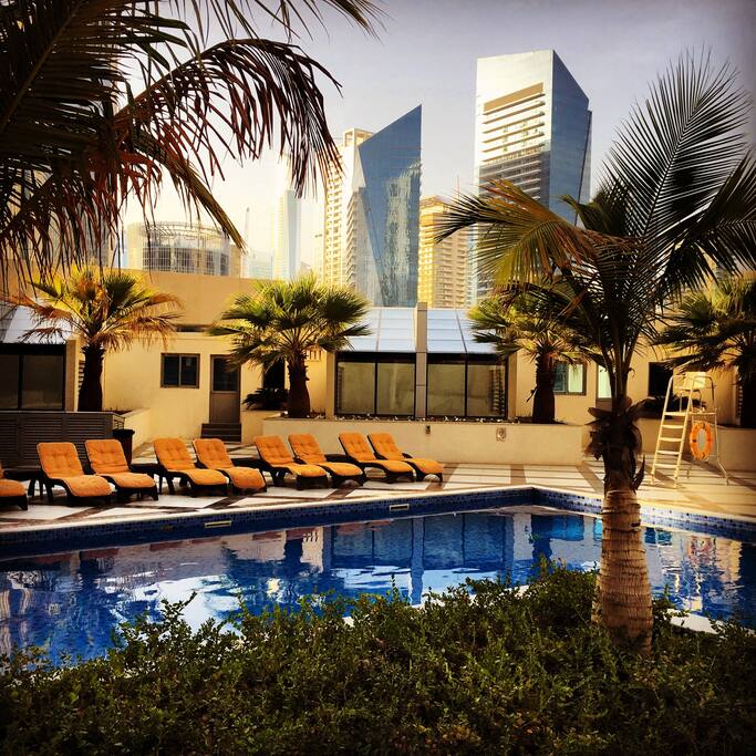Pool with palm trees & relaxing jacuzzi