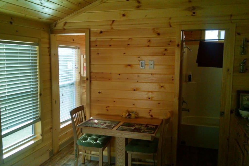 Lots of windows bring in the sunshine. A separate bedroom with a door and bunkbeds. Bathroom has full shower with bathtub