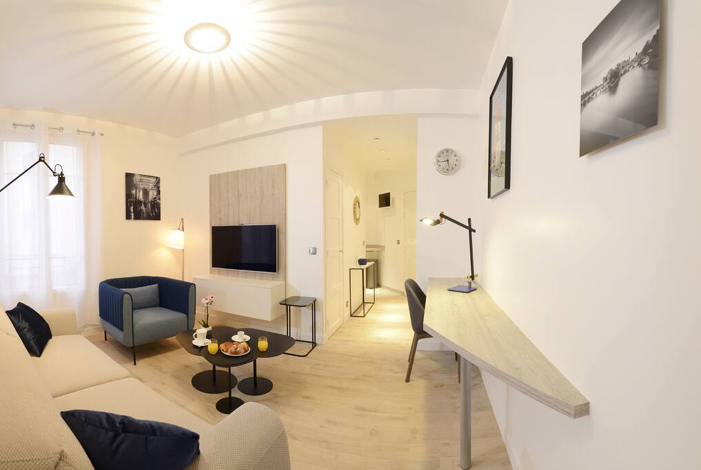 Living area with sofa bed convertible into 160x200 top of the range High-speed television and wifi Parquet flooring and decoration and library
