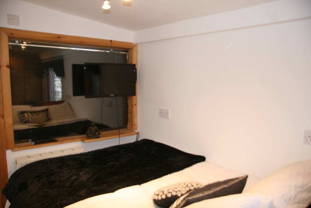 Bottom of the bed and TV