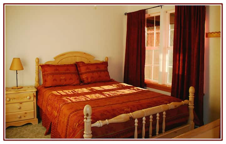 Queen bed in bedroom