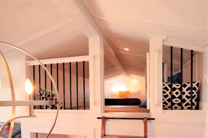 Double bed loft with 4 ft ceilings (accessible by ladder)
