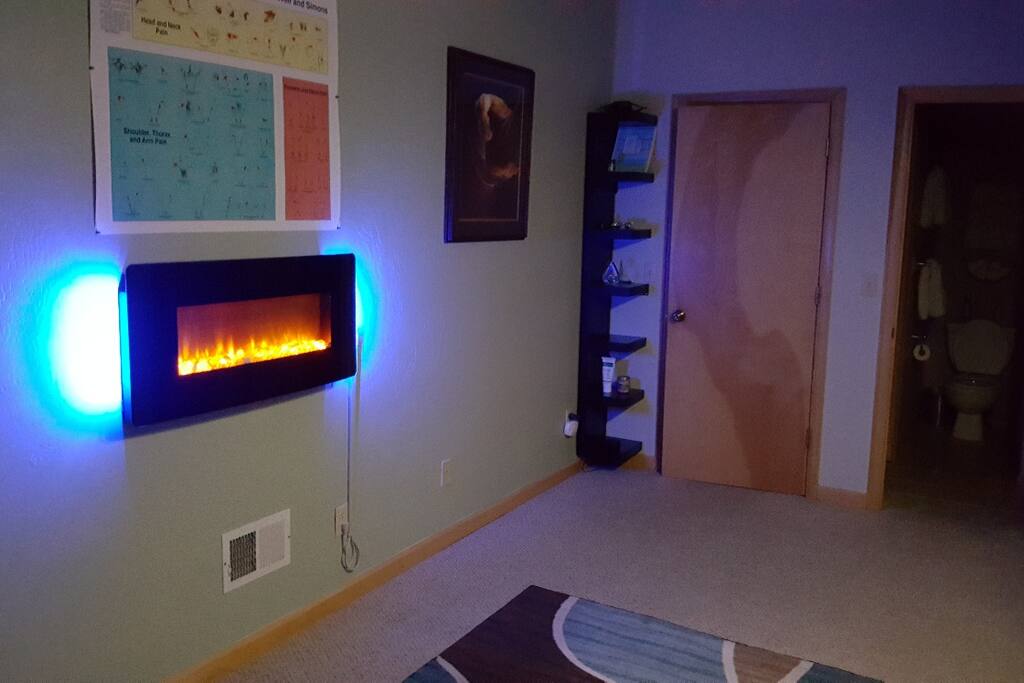 Wall mounted fireplace for added heat and ambience.
