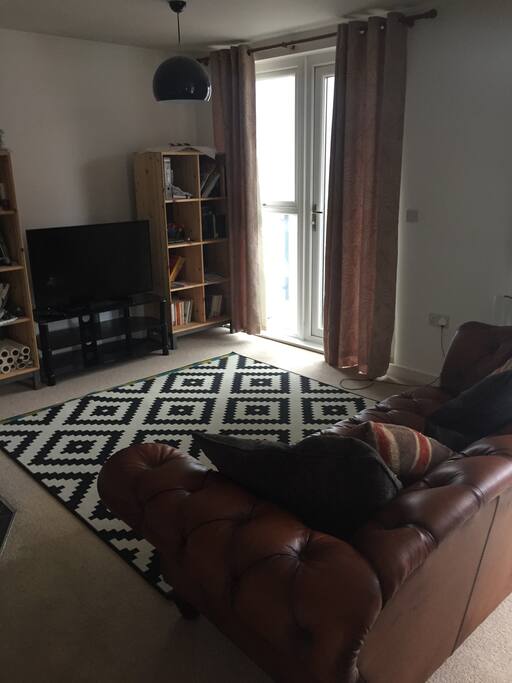 Large shared living room with kitchen and dining area