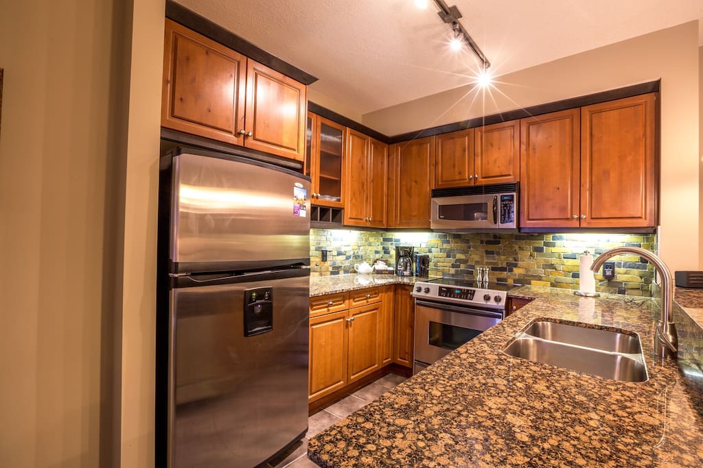 The kitchen is a pleasure to cook in, with high-end appliances and sleek finishings