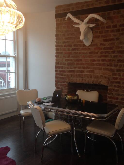 Dining table with open brick fireplace