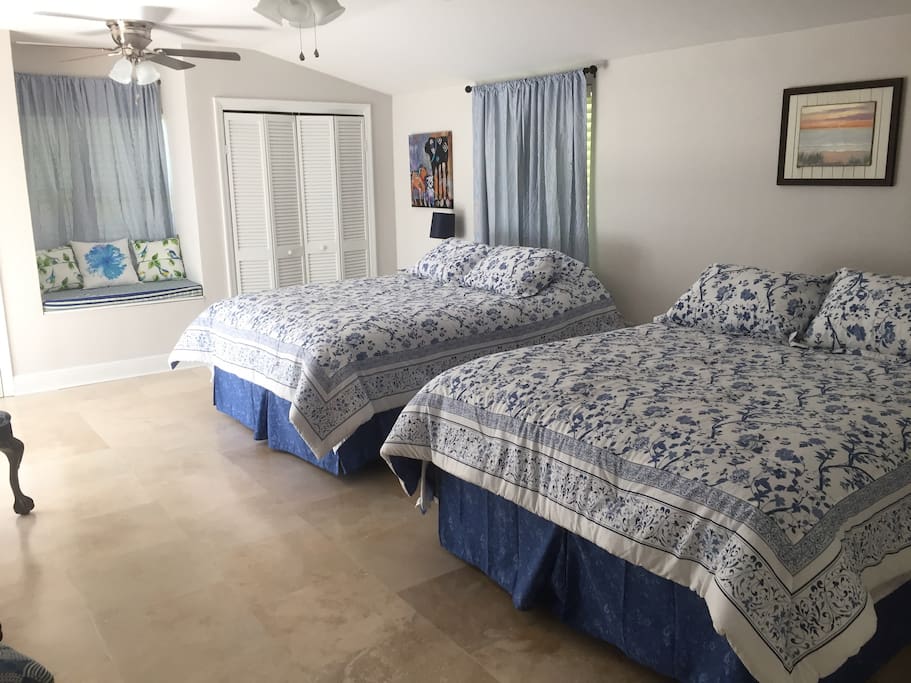 Large bedroom with a relaxing touch perfect for leaving the real world behind .