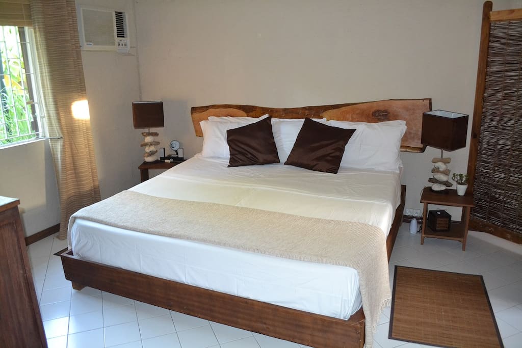 thi is your new room: the deluxe room with handmade natural wood and wooddrift decorations made by us and a 2mx2m bed