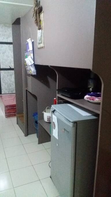 The refrigerator (personal size), rice cooker, induction cooker, and the dining wares.