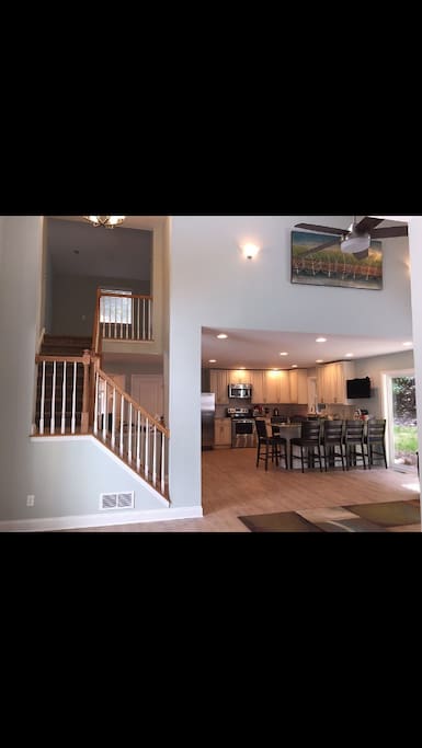This is the view as you enter the front door-great open floor plan and vaulted ceiling with view of upper level loft!