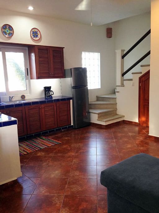 Penthouse Kitchen and stairs to third floor Bedroom and Deck