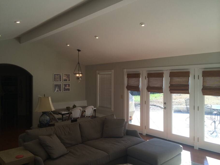 Main living area with built-in breakfast nook. Cathedral ceiling and lots of natural light.