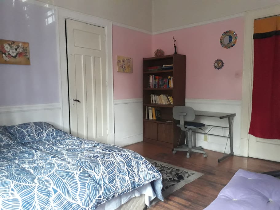 The room has a desk and a bookcase with some books for learning basic Spanish and guidebooks at your disposal