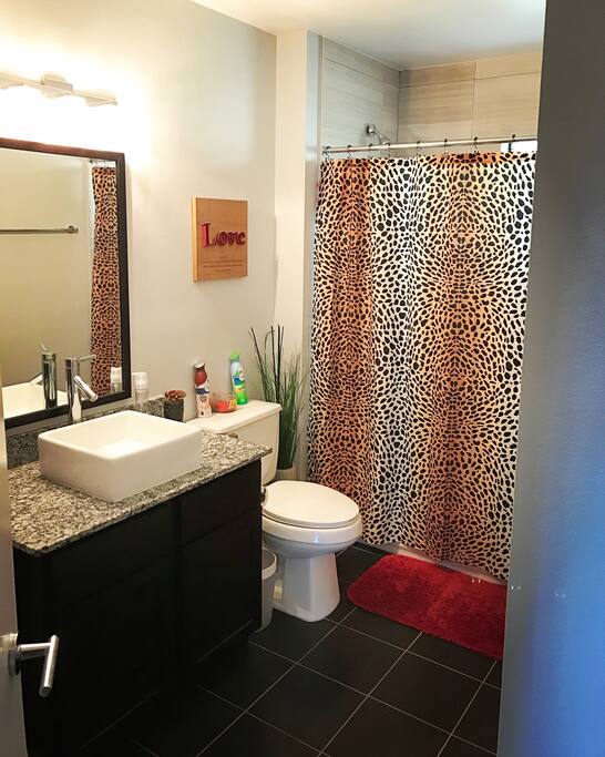Spacious upgraded bathroom with stackable washer & dryer. W/D included in rental.