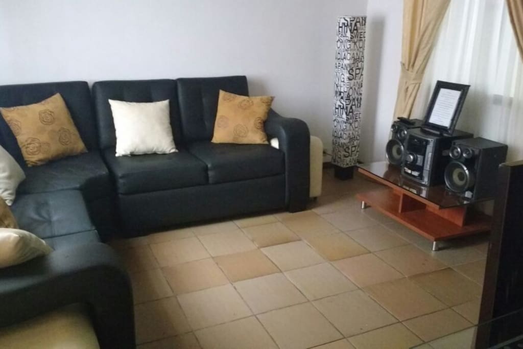 Beautiful black three piece sofa and stereo